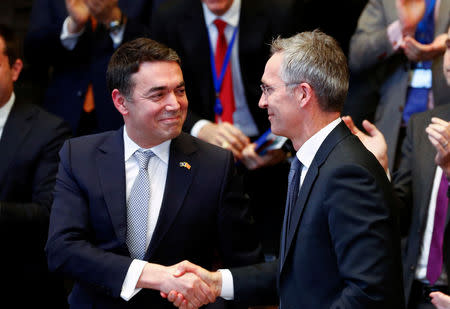 Macedonian Foreign Minister Nikola Dimitrov shakes hands with NATO Secretary General Jens Stoltenberg during a signature ceremony of the accession protocol between the Republic of North Macedonia and NATO at the Alliance headquarters in Brussels, Belgium February 6, 2019. REUTERS/Francois Lenoir