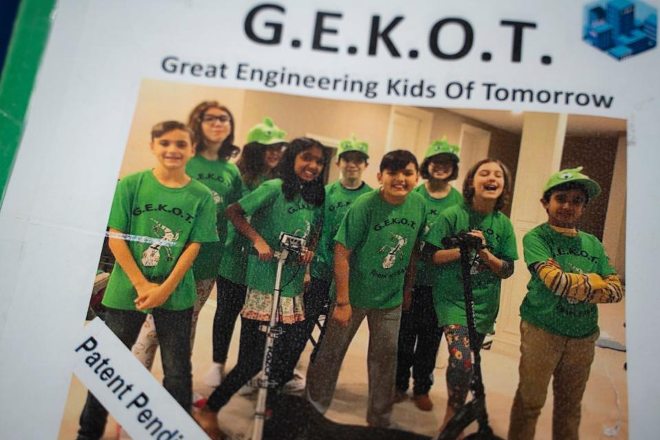 A group of student inventors from the Bloomfield Hills school district's GEKOT FIRST LEGO League Robotics Team are honored by the U.S. Patent and Trade Office for their e-scooter safety device at River Place in Detroit on Tuesday, Aug. 9, 2023.