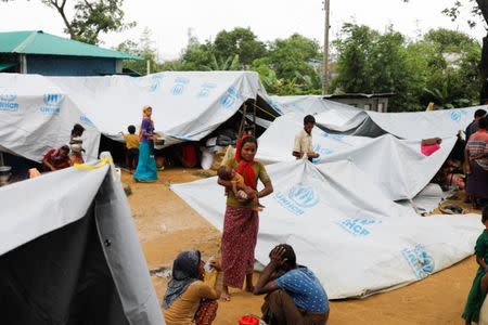 Rohingya refugees who crossed the border from Myanmar this week take shelter at a school in Kutupalong refugee camp near Cox's Bazar, Bangladesh October 21, 2017. REUTERS/Zohra Bensemra