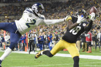 Seattle Seahawks cornerback D.J. Reed breaks up a pass to Pittsburgh Steelers wide receiver Diontae Johnson (18) during the first half an NFL football game, Sunday, Oct. 17, 2021, in Pittsburgh. (AP Photo/Don Wright)