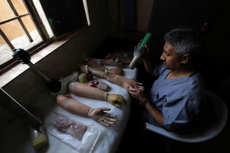 A worker prepares prosthetics at the Artificial Limb Centre in Basra, Iraq February 28, 2018. REUTERS/Essam Al-Sudani