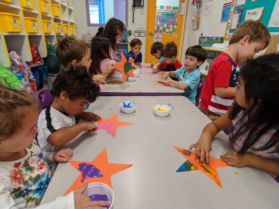 Preschool children doing arts and crafts.