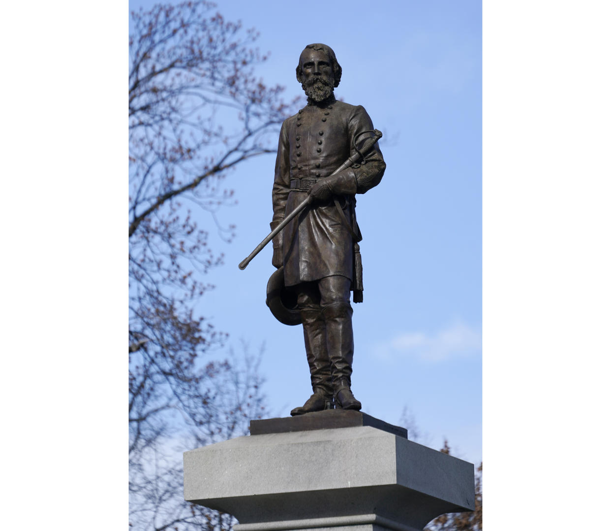 FILE - The monument of confederate General A.P. Hill, which contains his remains, is in the middle of a traffic circle on Arthur Ashe Blvd. Thursday Jan. 6, 2022, in Richmond, Va. Work to relocate Richmond’s final city-owned Confederate monument should start this week after a judge refused a request to delay the removal of the statue of Gen. A.P. Hill from its prominent spot in Virginia's capital, an official said. (AP Photo/Steve Helber, File)