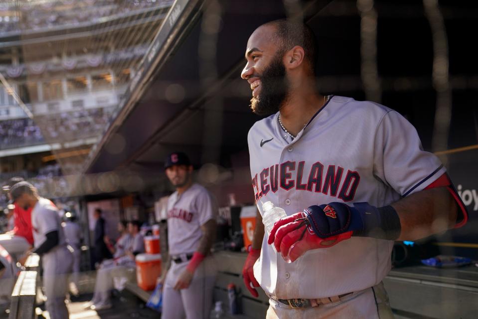 Cleveland Guardians Amed Rosario reacts in the dugout after hitting a solo home run against the New York Yankees during the fifth inning of Game 2 of an American League Division baseball series, Friday, Oct. 14, 2022, in New York. (AP Photo/John Minchillo)
