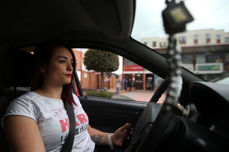 -teKaren Londono, an Uber driver, drives her car down a central street in Bogota