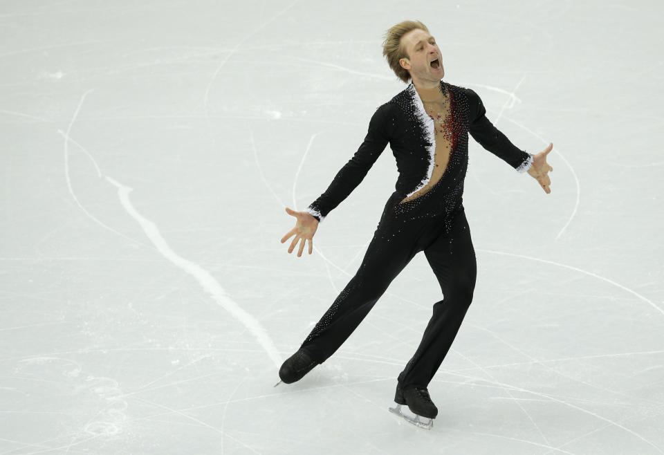 Evgeny Plyushchenko of Russia competes in the men's team short program figure skating competition at the Iceberg Skating Palace during the 2014 Winter Olympics, Thursday, Feb. 6, 2014, in Sochi, Russia. (AP Photo/Vadim Ghirda)