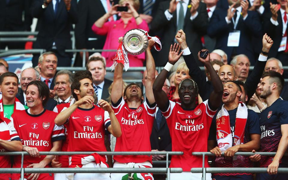 Aaron Ramsey lifts the trophy which ended a nine-year drought for Arsenal