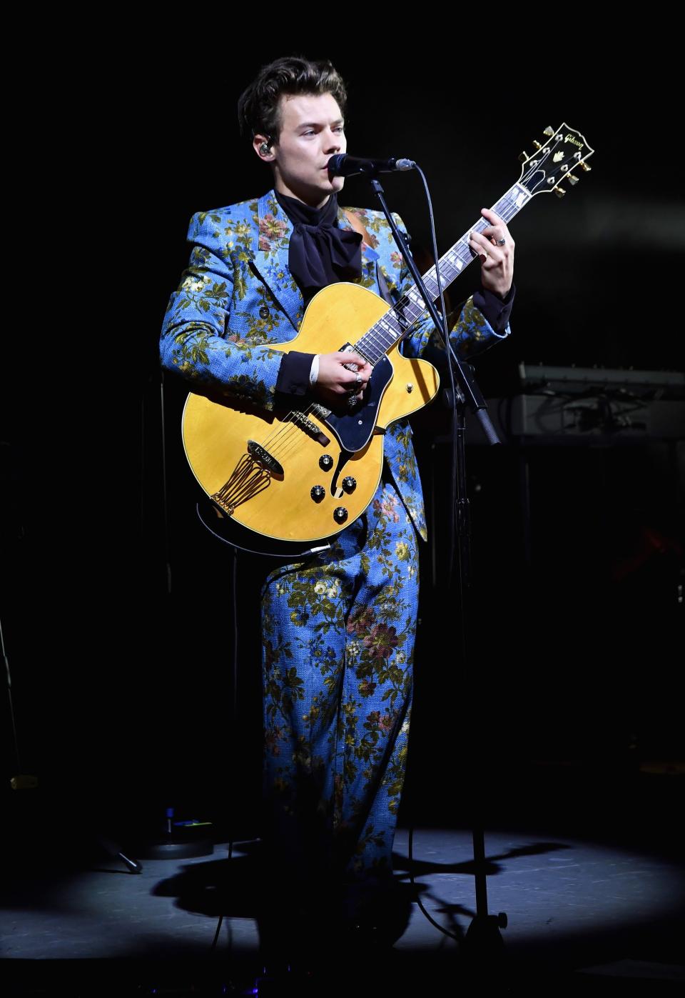 Printed suits? Check. Ruffled blouses? Double check. Harry Styles rules the red carpet in these campiest looks.