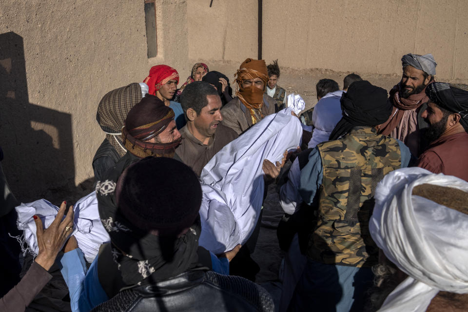 Afghan people carry the body of their relative killed in an earthquake to a burial site in Zenda Jan district in Herat province, western of Afghanistan, Sunday, Oct. 8, 2023. Powerful earthquakes killed at least 2,000 people in western Afghanistan, a Taliban government spokesman said Sunday. It's one of the deadliest earthquakes to strike the country in two decades. (AP Photo/Ebrahim Noroozi)