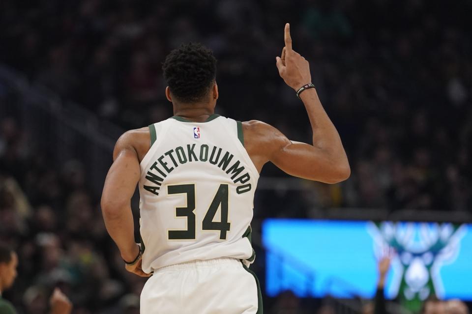 Milwaukee Bucks' Giannis Antetokounmpo reacts after a dunk during the first half of an NBA basketball game against the Cleveland Cavaliers Saturday, Dec. 14, 2019, in Milwaukee. (AP Photo/Morry Gash)