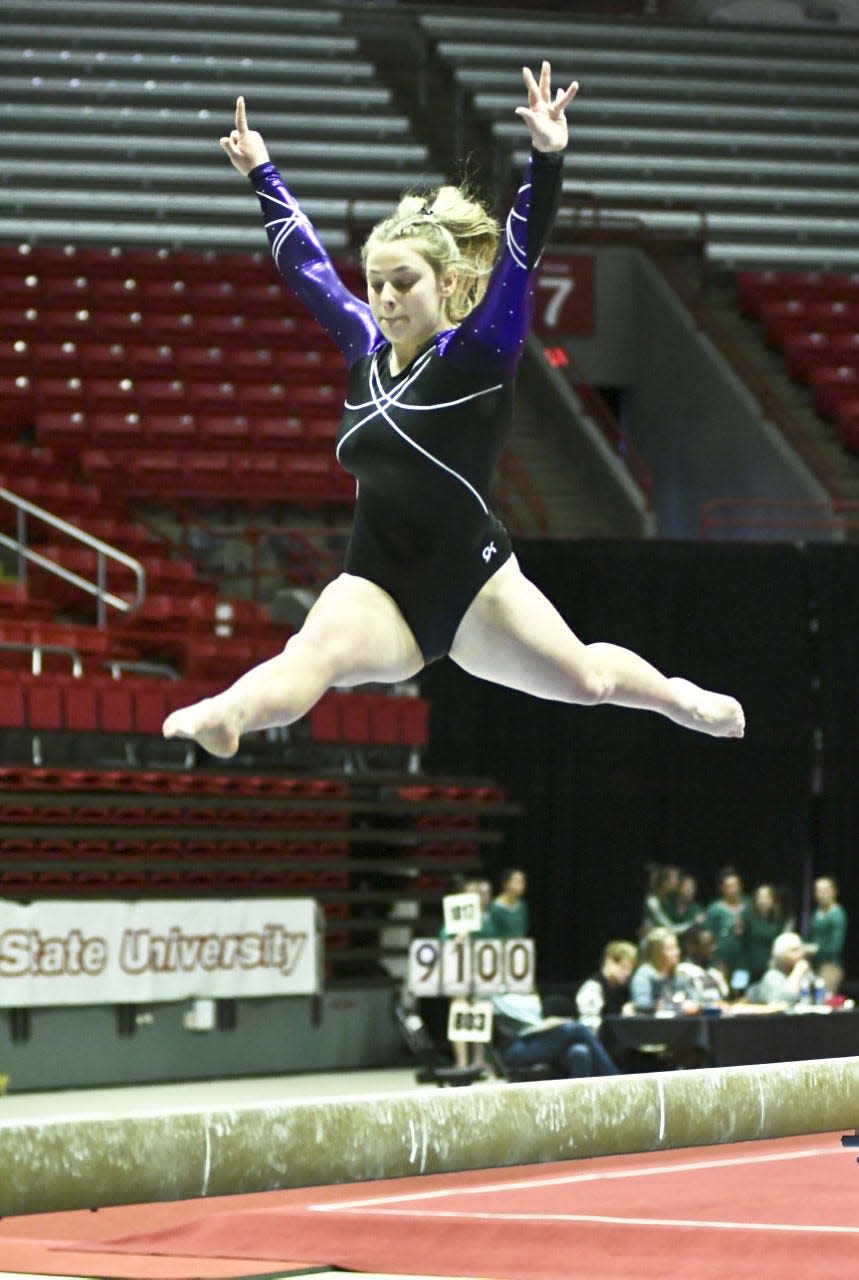 Bloomington South's Mia Langley competes on beam in the IHSAA state gymnastics meet at Ball State on Saturday, March 11, 2023.