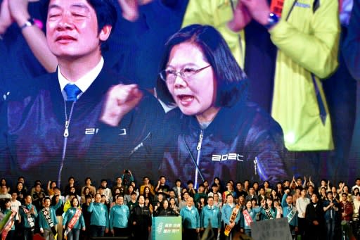 Taiwan's President Tsai Ing-wen (C) has seized on China's response to the Hong Kong protests in a way that analysys say has boosted her re-election prospects