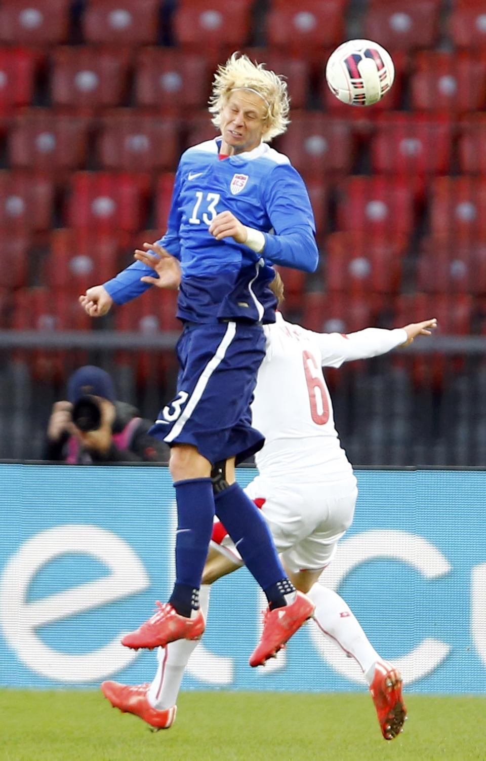 Silvan Widmer of Switzerland challenges Brek Shea of the U.S (front) during their international friendly soccer match at the Letzigrund Stadium in Zurich March 31, 2015. REUTERS/Arnd Wiegmann