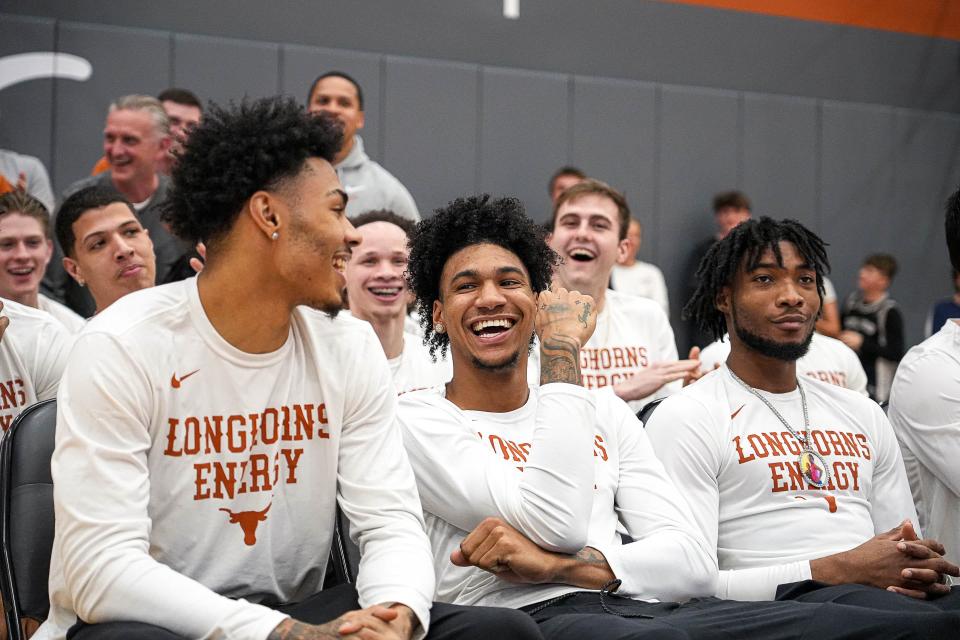 Texas basketball players Chris Johnson, left, and Dillon Mitchell share a laugh as the Longhorns are announced as a No. 7 seed in the NCAA Tournament on Selection Sunday. Both players said the G League Ignite, which is being disbanded by the NBA, offered an appealing option for elite high school players but lost some appeal with the arrival of NIL money in college athletics.