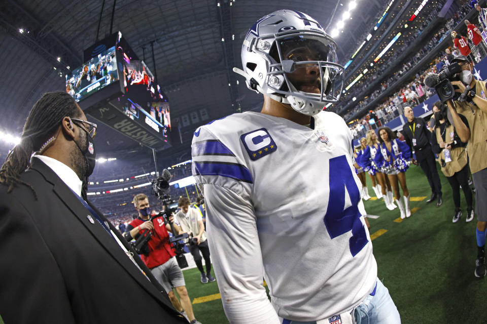 Dallas Cowboys quarterback Dak Prescott (4) leaves the field following an NFL wild-card playoff football game against the San Francisco 49ers in Arlington, Texas, Sunday, Jan. 16, 2022. The 49ers won 23-17. (AP Photo/Ron Jenkins)