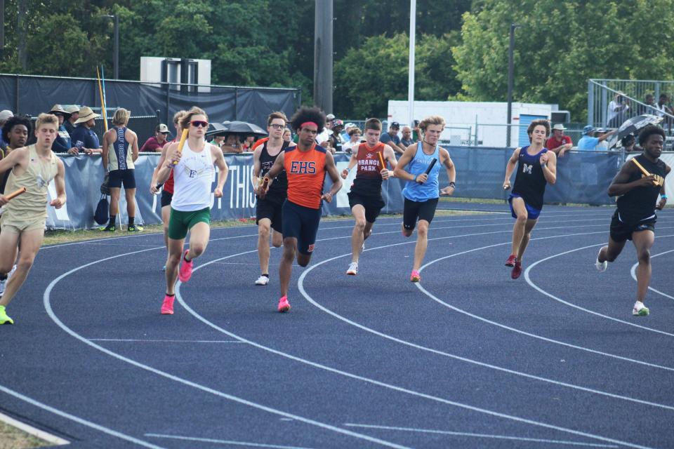 Runners round the first turn in the boys 4x800-meter relay during Thursday's FHSAA Region 1-3A high school track and field meet at the University of North Florida's Hodges Stadium. UNF is scheduled to host the state high school track championships from May 15-18.