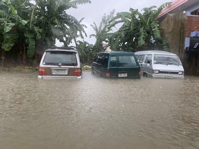 Cars sit in a flooded parking lot in the capital Manila after typhoon "Gaemi"known as "Karina" in the Philippines, caused severe flooding. Girlie Linao/dpa