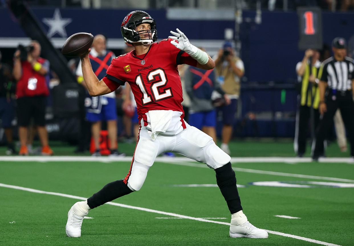 Tom Brady #12 of the Tampa Bay Buccaneers passes the ball against the Dallas Cowboys at AT&T Stadium on September 11, 2022 in Arlington, Texas.