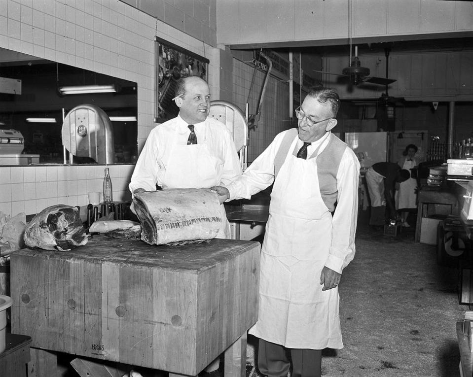 March 28, 1955: At Fort Worth’s Roy Pope Grocery, which is soon to become a Super Save Market, Roy Pope (right) and Willis McIntosh (left), manager of the meat market, look over a prime rib cut.