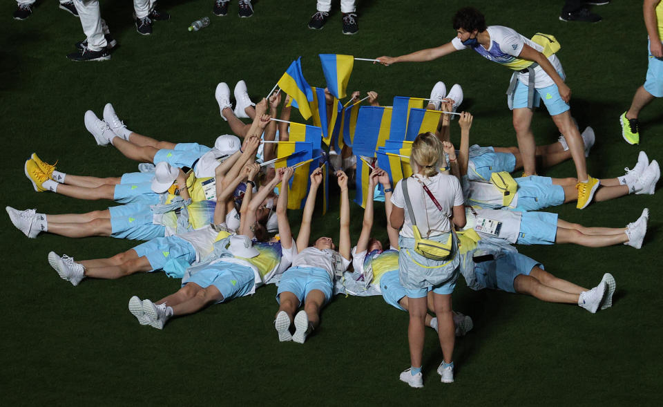 <p>Team Ukraine athletes attend the closing ceremony of the 2020 Summer Olympic Games at the Japan National Stadium (a.k.a the Olympic Stadium). The Olympic Games were held amid the COVID-19 pandemic. The closing ceremony features live and pre-recorded elements. Sergei Bobylev/TASS (Photo by Sergei Bobylev\TASS via Getty Images)</p> 
