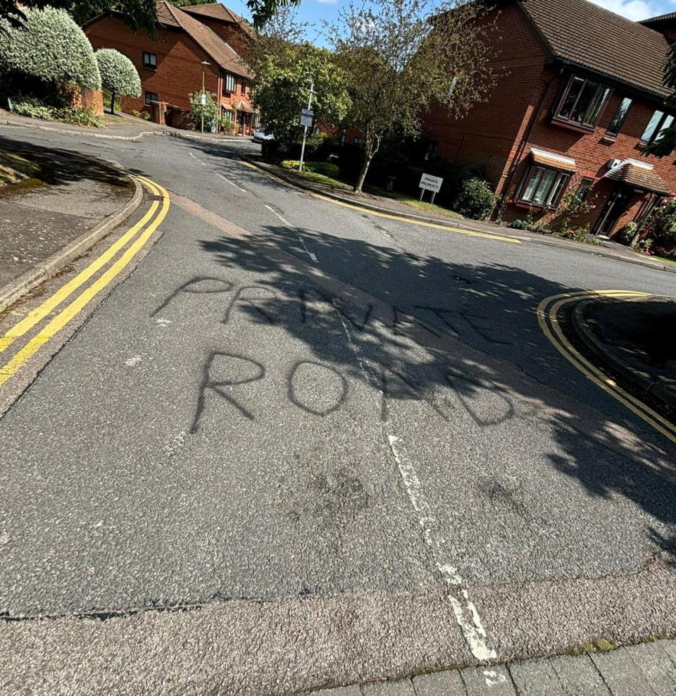 Graffiti stating âprivate roadâ at the entrance to the cul-de-sac. Photo released September 5 2024. A disgruntled resident has taken to blocking a footpath with their car in a long-running row over primary school parking.A cul-de-sac in Bushey, Hertfordshire, has been in an ongoing feud with parents who use the private road to park when dropping their kids off at school. The Meadowcroft estate just off the high street is connected by a footpath to St Hildaâs Preparatory School, which makes it an ideal spot for parents to park- to the frustration of residents.Around 18 months ago, ANPR cameras were installed to discourage parents parking and Â£100 penalty charges started appearing in the post.
