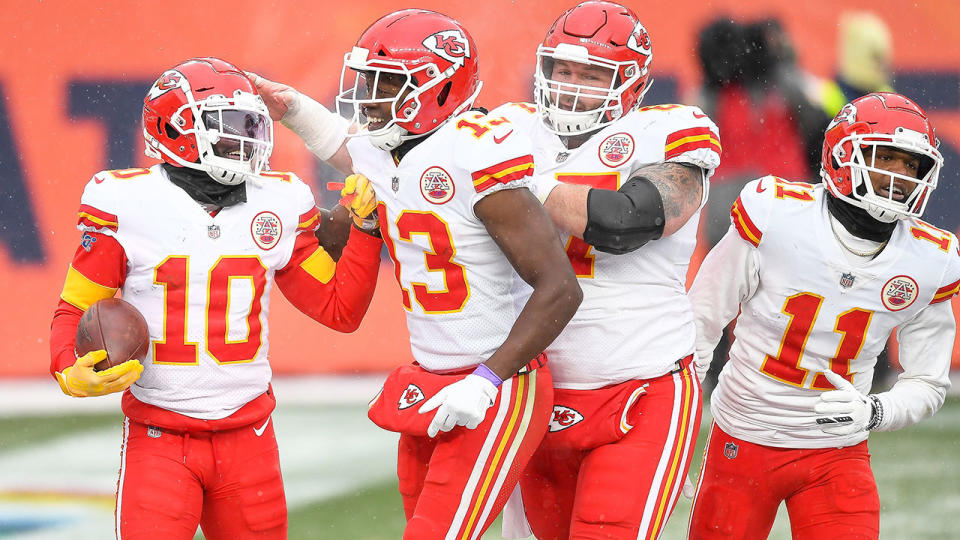 Kansas City Chiefs players Daniel Kilgore and Demarcus Robinson are seen here celebrating with teammates.