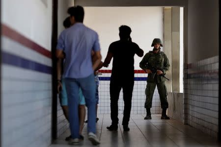 Marines patrol a polling station during municipal elections in Sao Luis, Brazil, October 2, 2016. REUTERS/Ueslei Marcelino