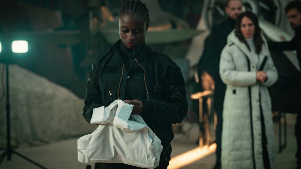 A still from Netflix sci-fi movie Paradise, showing Kaya with a bulletproof vest.