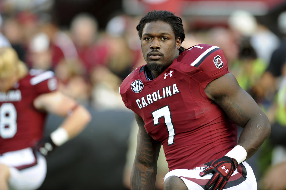 FILE - South Carolina defensive end Jadeveon Clowney (7) stretches during pre-game warmups before the start of an NCAA college football game against Vanderbilt, Saturday, Sept. 14, 2013 in Columbia, S.C. Cleveland defensive end Jadeveon Clowney will have his college jersey retired at South Carolina's season opener with Georgia State on Sept. 3. The school announced the retirement of Clowney's No. 7 on Friday, Aug. 26, 2022.(AP Photo/Stephen Morton, File)