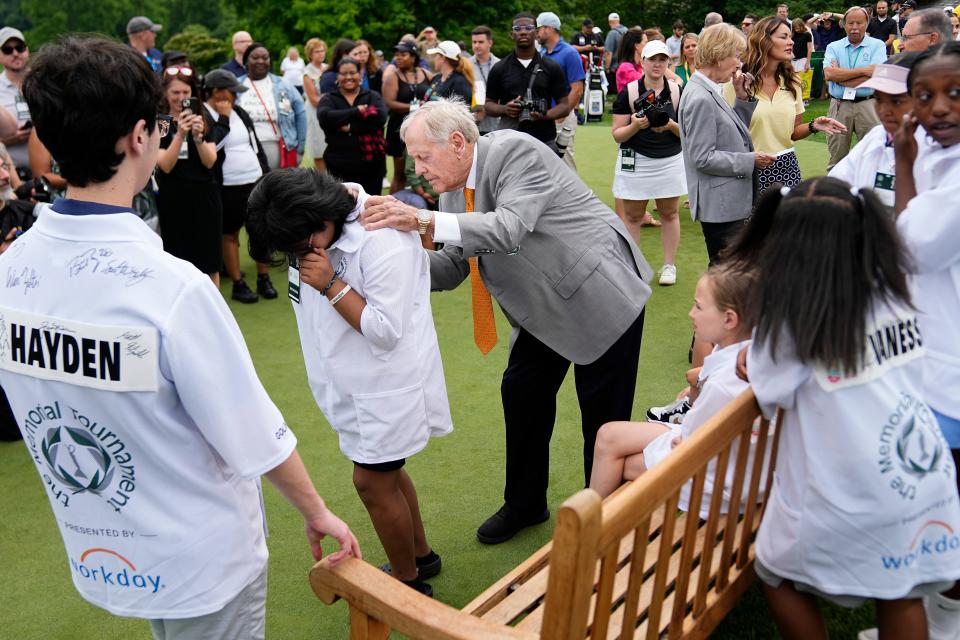 Jun 5, 2024; Columbus, Ohio, USA; Jack Nicklaus signs autographs for kids in the Nationwide Children’s Hospital Golden Cub program during a practice day for the Memorial Tournament at Muirfield Village Golf Club.