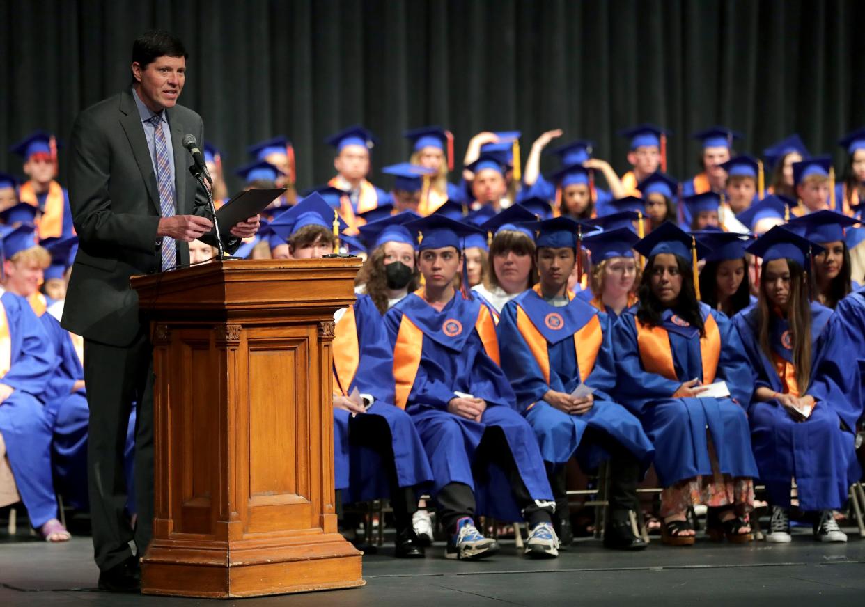 Chief Financial Officer Greg Hartjes gives a speech during the Appleton West High School 2022 graduation ceremony. High school students planning to attend college will use a new financial aid form this year.