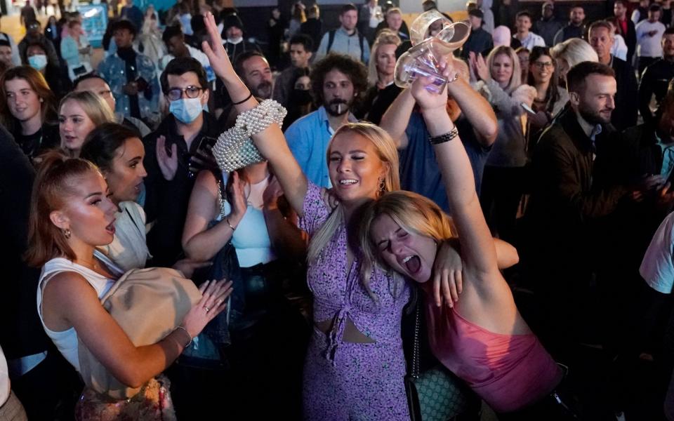 Revellers on a night out - Will Oliver/Shutterstock