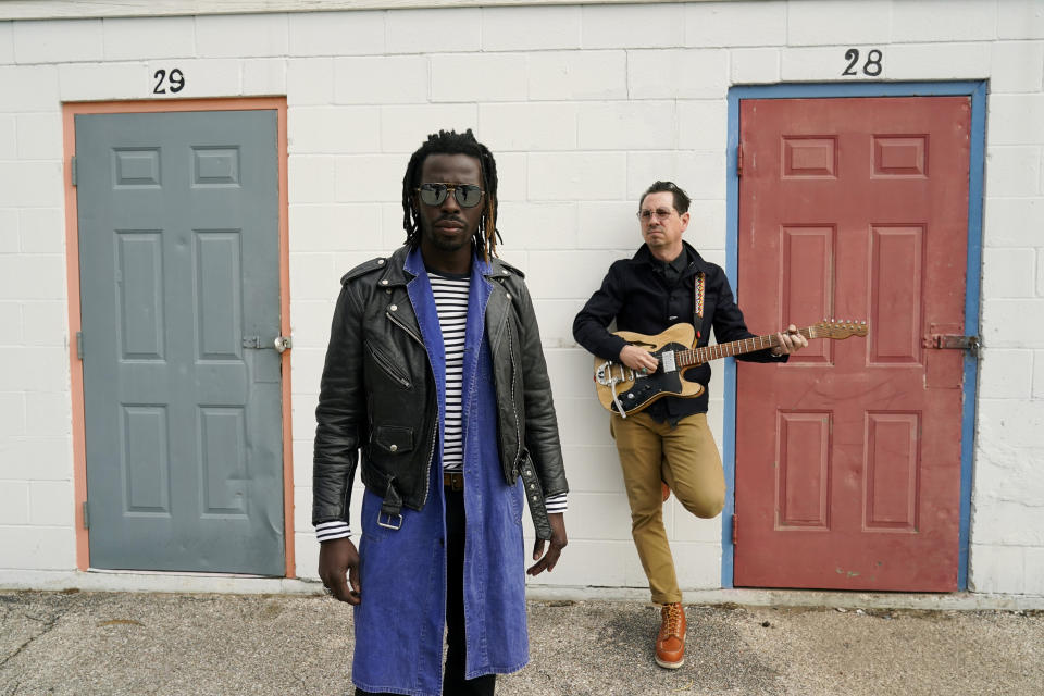 Adrian Quesada, left, and Eric Burton, of Black Pumas, pose for a portrait in Austin, Texas on Feb. 5, 2021. Their deluxe debut album is nominated for album of the year at the 2021 Grammy Awards and their single “Colors” is nominated for record of the year and best American roots performance. (AP Photo/Eric Gay)