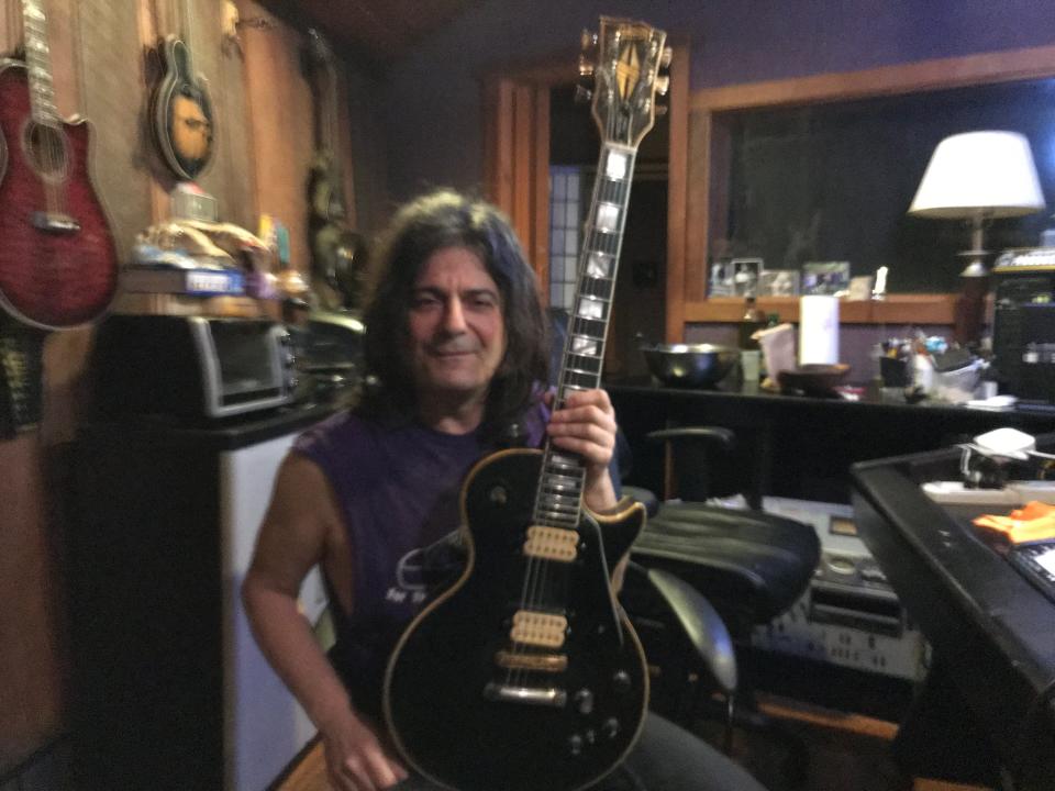 David Granati in his Ambridge studio with his favorite guitar.