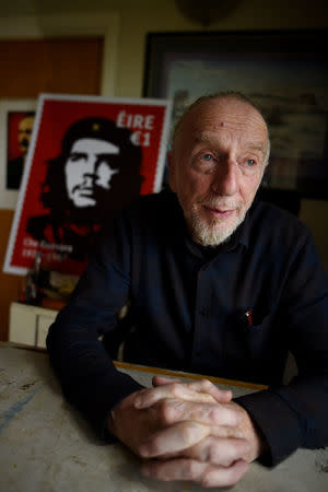 Artist Jim Fitzpatrick who has created an Irish postage stamp using the poster of Che Guevara he created in 1968 entitled 'Viva Che!' based on a photograph by Alberto Korda poses for a picture at his studio in Dublin, Ireland October 11, 2017. REUTERS/Clodagh Kilcoyne