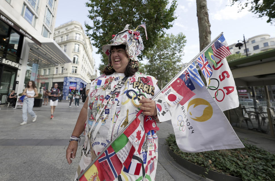 Vivianne Robinson poses a photo, during 2024 Summer Olympics, in Paris, France, Tuesday, July 30, 2024. The Olympics superfan has attended seven Games over the span of 40 years. (AP Photo/Lujain Jo)