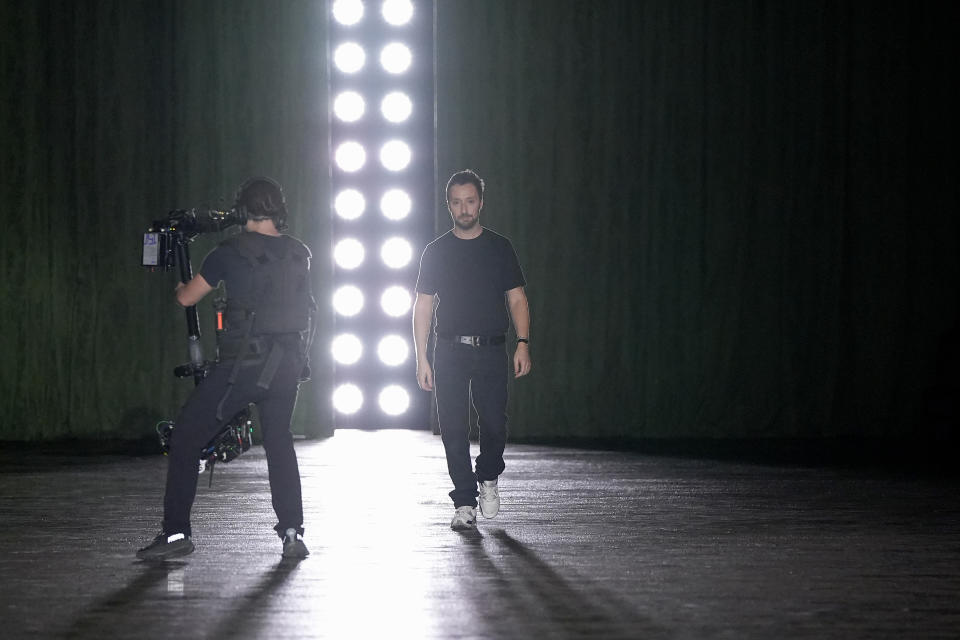 Anthony Vaccarello walks the runway after his Paris Fashion Week presentation