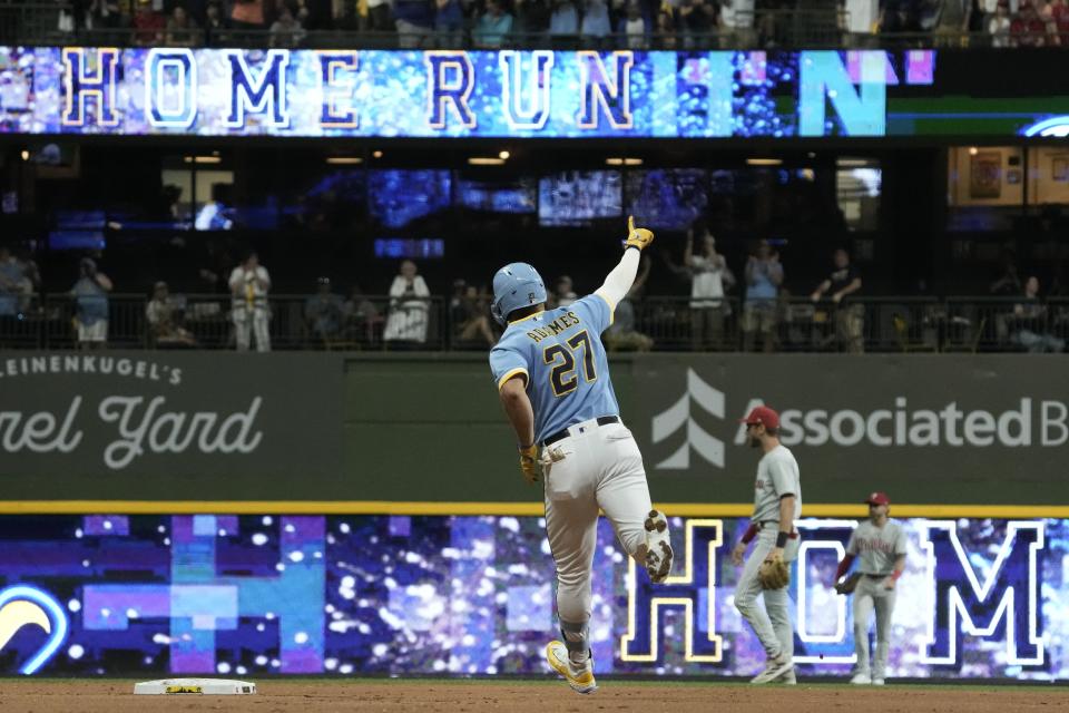 Milwaukee Brewers' Willy Adames reacts after hitting a three-run home run during the fourth inning of a baseball game against the Philadelphia Phillies Friday, Sept. 1, 2023, in Milwaukee. (AP Photo/Morry Gash)