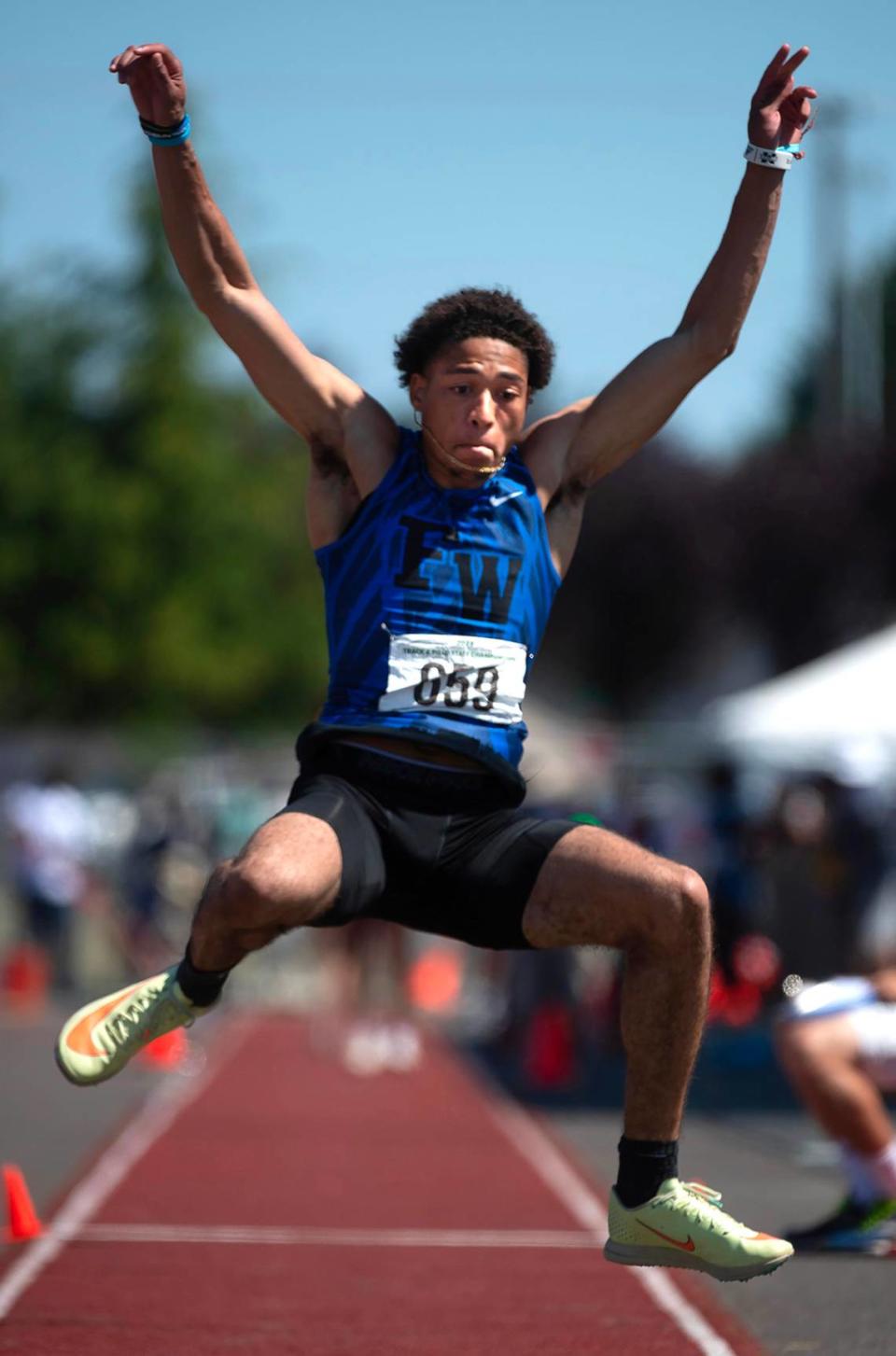 Federal Way’s Roman Hutchinson leaps to a state title in the 4A boys triple jump competition during the second day of the WIAA state track and field championships at Mount Tahoma High School in Tacoma, Washington, on Friday, May 26, 2023.