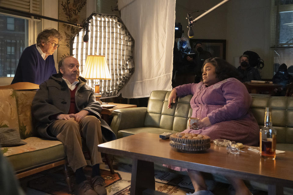 This image released by Focus Features shows director Alexander Payne, from left, and actors Paul Giamatti and Da'Vine Joy Randolph on the set of their film"The Holdovers." (Seacia Pavao/Focus Features via AP)