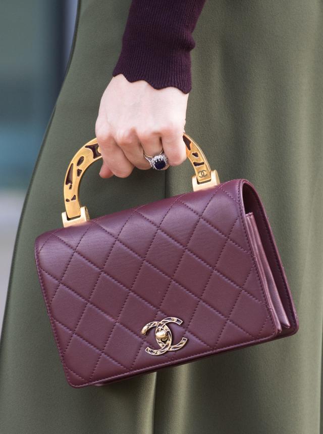 Kate Middleton Wears a Chanel Bag, Green Pants & Purple Sweater