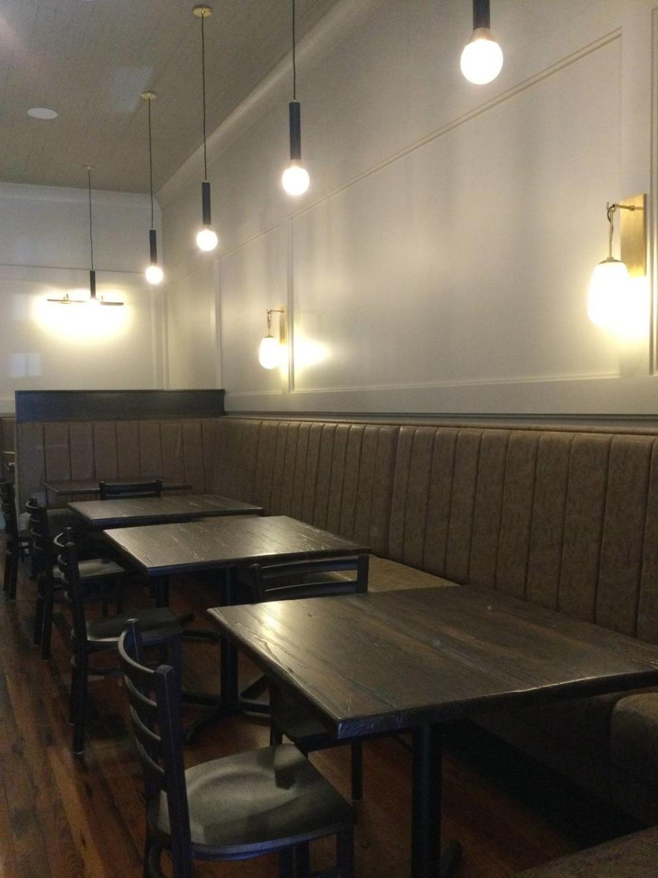 Tables along a wall at Oliver Perry’s, a new fine dining restaurant and bar opening in early 2022 at 805 Caroll St. in downtown Perry.