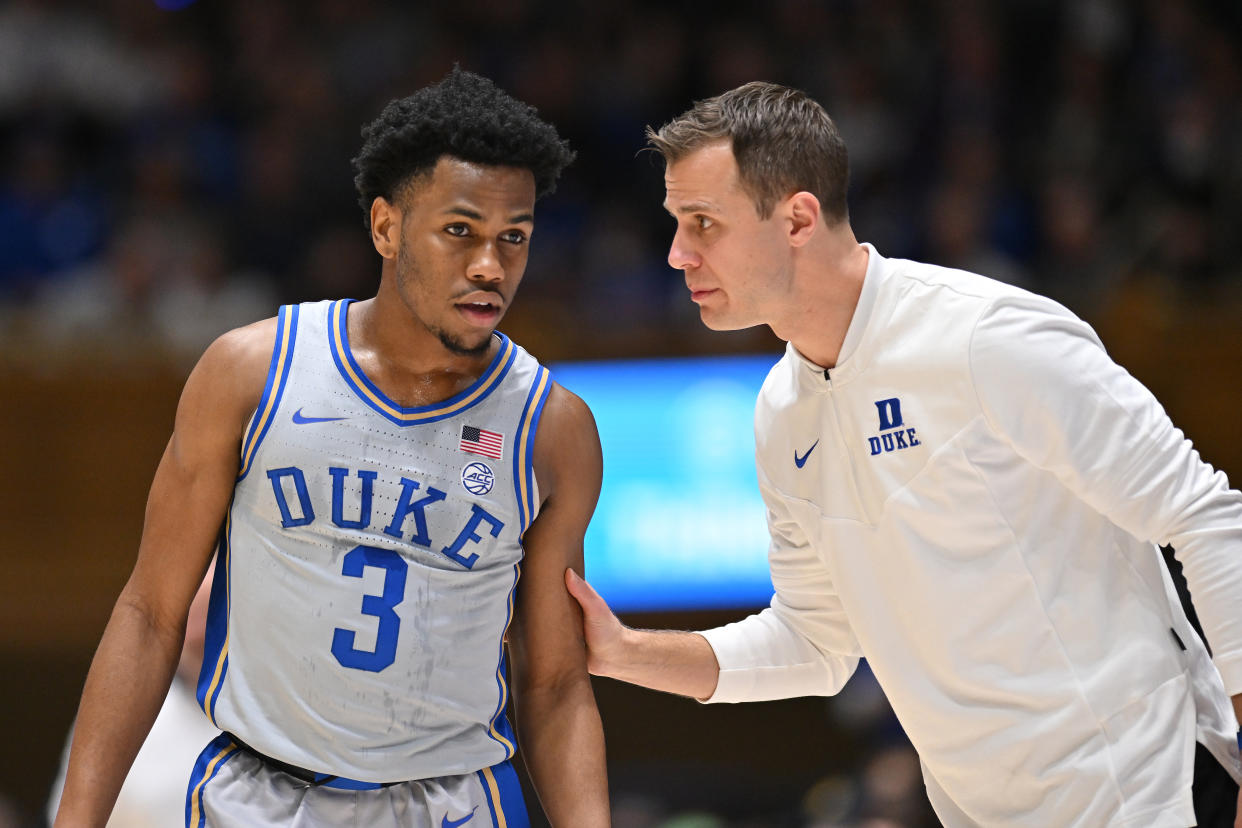 Duke coach Jon Scheyer talks with Jeremy Roach during their game against Notre Dame on Feb. 14. (Grant Halverson/Getty Images)