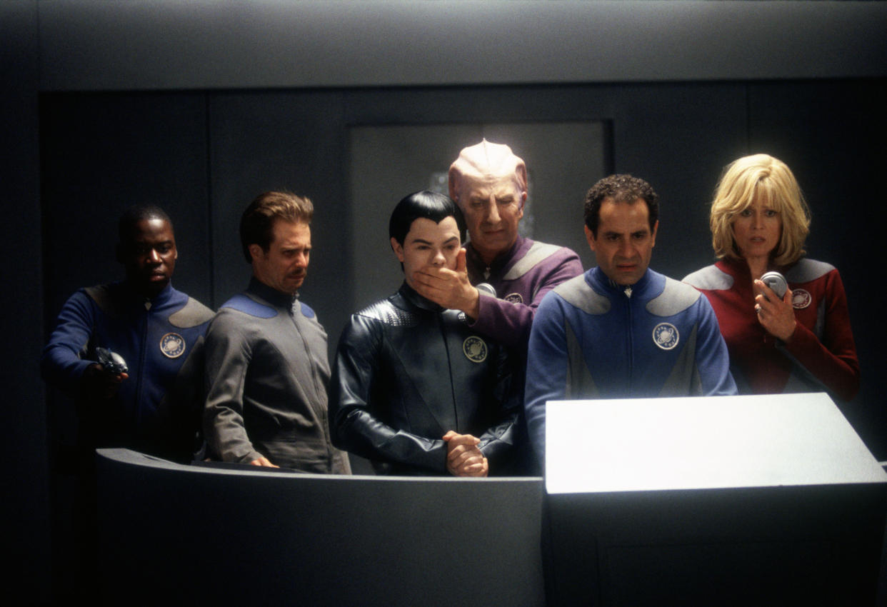 From left to right, actors Daryl Mitchell, Sam Rockwell, Jed Rees, Alan Rickman, Tony Shalhoub and Sigourney Weaver in a scene from the film 'Galaxy Quest', 1999.  (Photo by Murray Close/Getty Images)