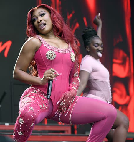 <p>Tim Mosenfelder/Getty Images</p> Megan Thee Stallion performs in August 2023