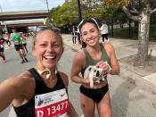 Sarah Bohan (right) and Gia Nigro escort the kitten to safety.