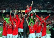 FILE PHOTO: Manchester United's players celebrate with the European Cup following their dramatic 2-1 victory over Bayern Munich in the final at Camp Nou in Barcelona, Spain.