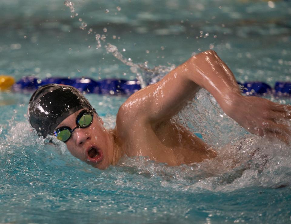 Thurston's Quinn Devenport competes in the boys 500 yard freestyle on his way to victory during the 5A Midwestern League district meet at Willamalane Pool in Springfield Saturday, Feb. 11, 2023.
