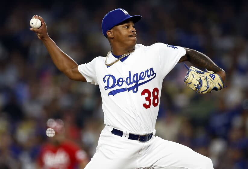 LOS ANGELES, CALIFORNIA - JULY 28: Yency Almonte #38 of the Los Angeles Dodgers throws against the Cincinnati Reds.