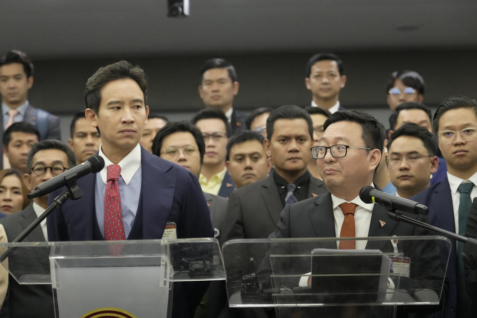 Former leader of Move Forward Party Pita Limjaroenrat, left, and the party's current leader Chaithawat Tulathon talk to reporters during a news conference at parliament in Bangkok, Thailand, Wednesday, Jan. 31, 2024. Thailand's Constitutional Court on Wednesday ruled that the progressive Move Forward party must cease advocating amending the law on royal defamation, action the court's nine judges deemed unconstitutional. (AP Photo/Sakchai Lalit)